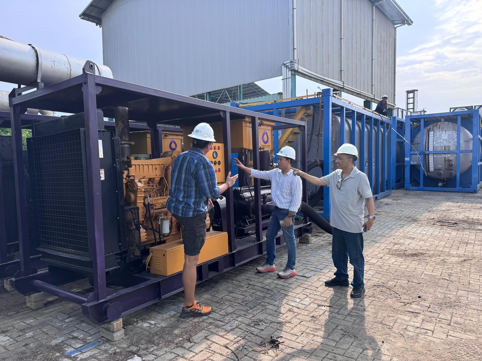 PT Tangki Kita team inspecting pumping equipment at the yard